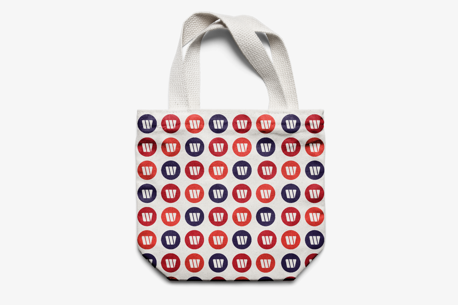 Wirtschaftsbund Stofftasche mit Muster bestehend aus orangen, roten und violetten Icons.